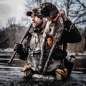 Nate Akey duck hunting with his German Shorthaired Pointer