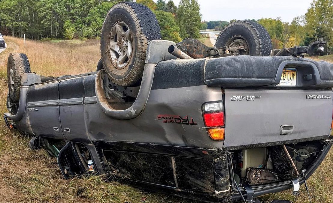 A car rests in the median after a wreck.